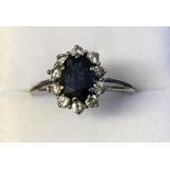 White gold, sapphire and diamond daisy style ring
