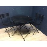 Black painted metal circular garden table & 2 metal folding chairs