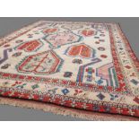 Anatolian carpet, Turkey, cream ground with geometric borders and symbols 3.20x2.50 metres