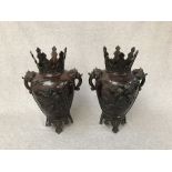 Pair of late C19th Oriental bronze vases with raised decoration of birds and flowers beneath