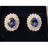 Pair of 18 carat white gold, tanzanite and diamond earrings, 4 carats total weight