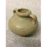 Small twin handled pottery vessel, 6cmH