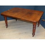 A Victorian walnut extending dining table with one leaf