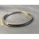 18 carat white gold, sapphire and diamond bangle, 3.5 carats