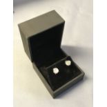 Pair of 14 carat white gold and diamond stud earrings, 2.1 carats