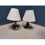 Pair of cast iron wall brackets, fitted for electric, pair of cast iron table lamps and shades