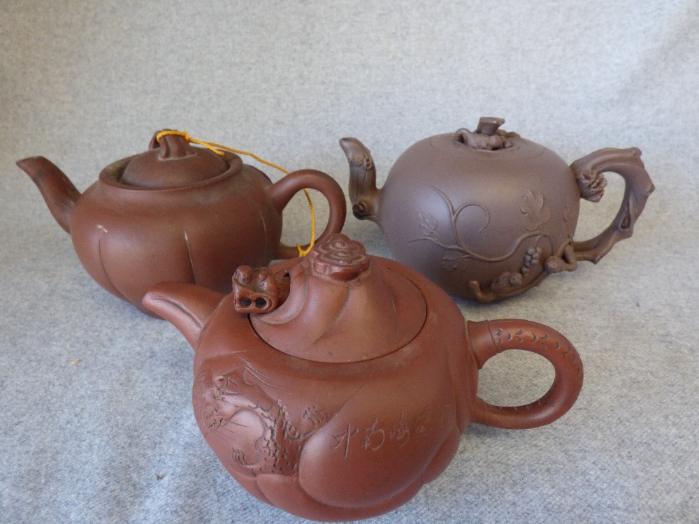 3 various Chinese teapots.