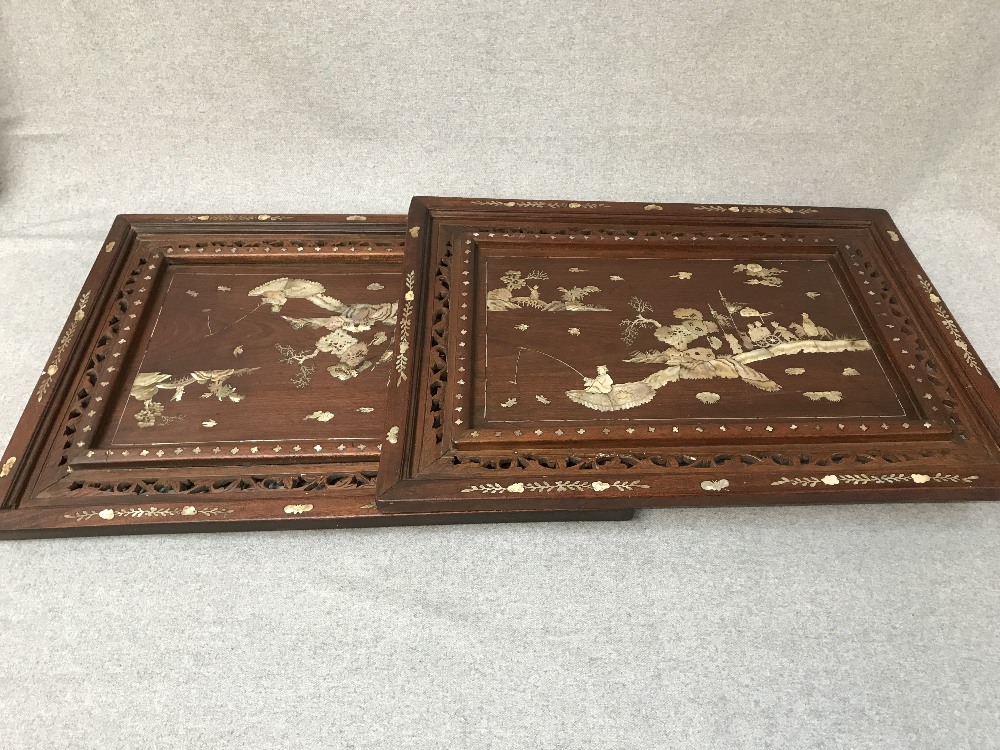 Pair of Chinese carved wooden panels, with mother of pearl inlay, depicting figures in a Chinese