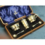 Cased hallmarked silver cruet set with blue glass liners, 3 ozt