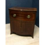 C19th mahogany bow front commode with single deep drawer above a pair of doors on bracket feet