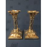 Pair of hallmarked silver square based candlesticks with swags & ram's head decoration, London 1895,