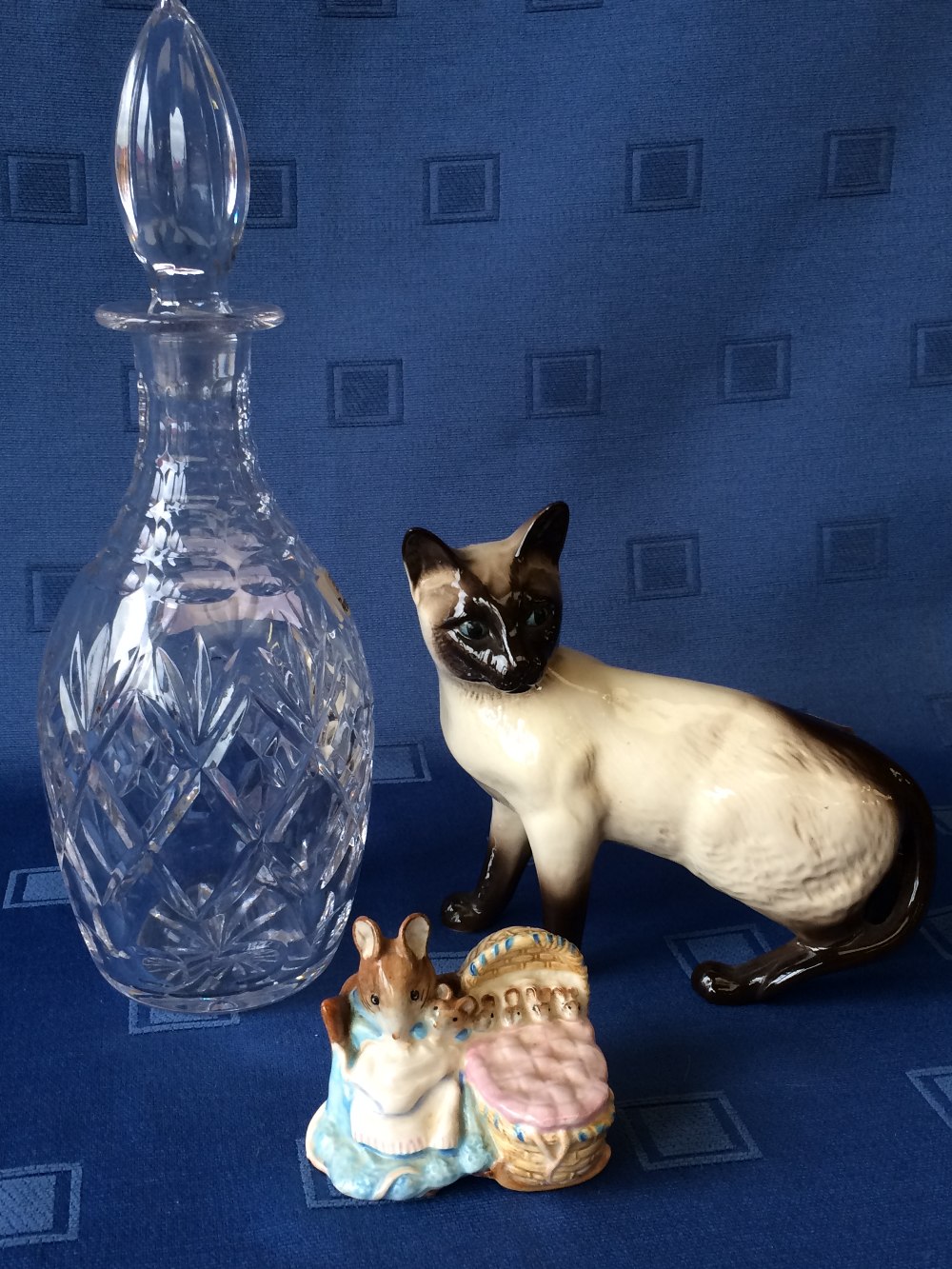 Beswick figure of a Siamese cat, a Beswick Beatrix Potter Hunca Munca figure & a cut glass decanter