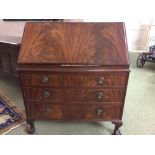 Mahogany bureau with bow fronted drawers on carved cabriole legs