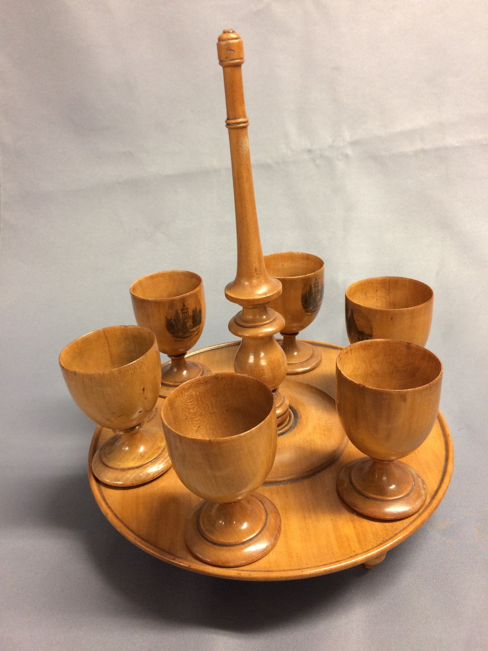 Good Mauchline ware egg cruet stand stamped "Wood grown on the banks of the Doon" each cup with a