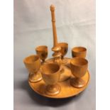 Good Mauchline ware egg cruet stand stamped "Wood grown on the banks of the Doon" each cup with a