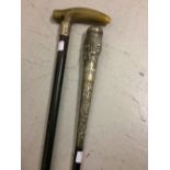 Indian Malaca walking stick with white metal top and a horn handled walking cane