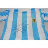 Maradona signed shirt. Replica blue and white stripe Argentina short sleeve shirts with number 10 on