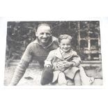 Don Bradman. Original mono press photograph of Bradman sitting in his garden at his Adelaide home