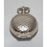 Golf ball shaped sovereign case. Silver metal case with button action to top. Metal ring suspension.