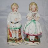 Staffordshire cricketing figures. Pair of early mid 19th Century Staffordshire figures of a young