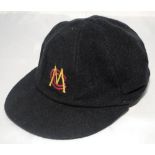 Marylebone Cricket Club black cricket cap with MC.C. emblem in gold and red. The cap by Albion C&D