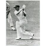 Don Bradman. Two mono library press photographs of Bradman playing a drive during his record