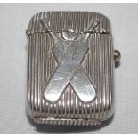 Cricket vesta case. Excellent silver metal vesta case, grooved case with crossed cricket bats and