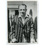 Don Bradman. Original mono photograph of Bradman, half length wearing striped blazer and cricket