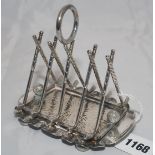 Golf toast rack. Silver plated toast rack with four divisions formed by crossed golf clubs with a
