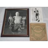 Henry Cooper. Two mono photographs of Cooper, both signed by Cooper. The larger of the two is