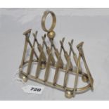 Cricket toast rack c1900. A brass six division toast rack with five pairs of angled bats, angled