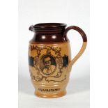 W.G. Grace. Doulton Lambeth stoneware jug with pale body and dark brown rim, decorated with three