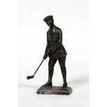 Golf figure. Attractive metal figure of a golfer wearing jacket and cap and plus fours with golf