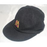 Marylebone Cricket Club black cricket cap with MC.C. emblem in gold and red. The cap by Albion C&D