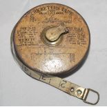 'Cricketers' Tape'. Original measuring tape with brass fittings. The tape has a paper/card insert to