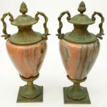 Pair of Mid Century French Style Rose Marble and Gilt Bronze Mounted Urns. Decorated with entwined