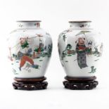 Pair of 19th Century Chinese Famille Vert Hand Painted Jars on Wooden Stands. Decorated with