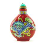 Antique Chinese Peking Glass and Enamel Snuff Bottle. Enamel painted foo dog motif on front and