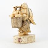 Japanese Carved Bone Polychrome Traveling Buddha Figurine. Unsigned. Left hand has an old repair (