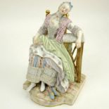 Antique Meissen Hand Painted Porcelain Figurine. Depicts a resting maid with her shoes off and a