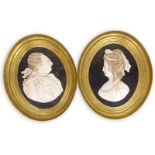 Pair of 20th Century Framed Carved Marble Relief Portrait Plaques, George and Martha Washington.