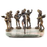 20th Century Bronze Figures on Marble Base. Depicts a group of 7 cherub music players with a