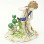 19th Century Meissen Porcelain Putti Gardener Figurine. Blue crossed swords mark with impressed