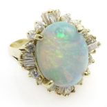 Vintage Approx. 8.0 Carat Oval Cabochon Cut Opal, 1.50 Carat Baguette and Round Cut Diamond and 14