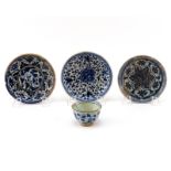 Grouping of Four (4) 17th Century Persian Blue and White Glazed Ceramic Saucers and Cup. Depicts