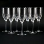 Seven (7) Lalique Crystal Ange/Angel Champagne Flutes. Signed. Good condition. Measures 8". Shipping