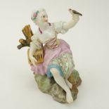 19th Century Meissen Porcelain Seated Girl with Bird Figurine. Blue crossed swords mark on