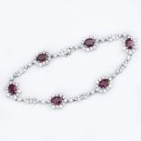 Approx. 5.0 Carat Oval Cut Ruby, 4.75 Carat Round Brilliant and Baguette Cut Diamond and 18 Karat