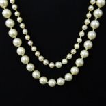 Two (2) Vintage Single Strand Pearl Necklaces. Pearls measure 8mm; 5mm. Unsigned. One needs repair