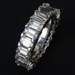 Contemporary Approx. 6.0 Carat Emerald Cut Diamond and Platinum Eternity Band. Diamonds F-G color,